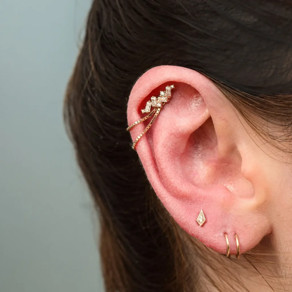 Close-up of an ear with multiple piercings